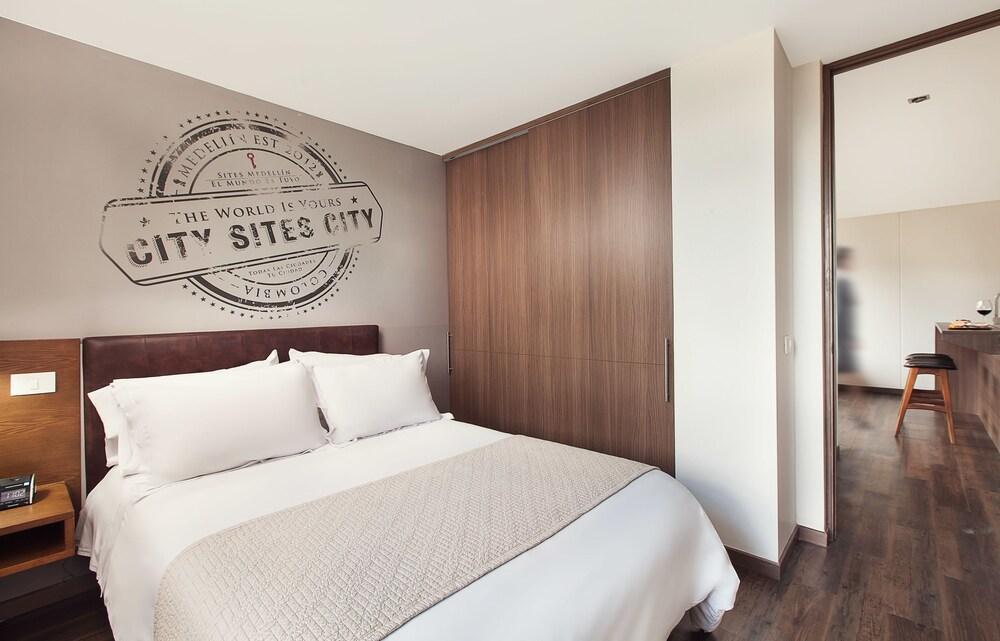 Sites Hotel Medellin Exterior photo A bedroom in a typical apartment