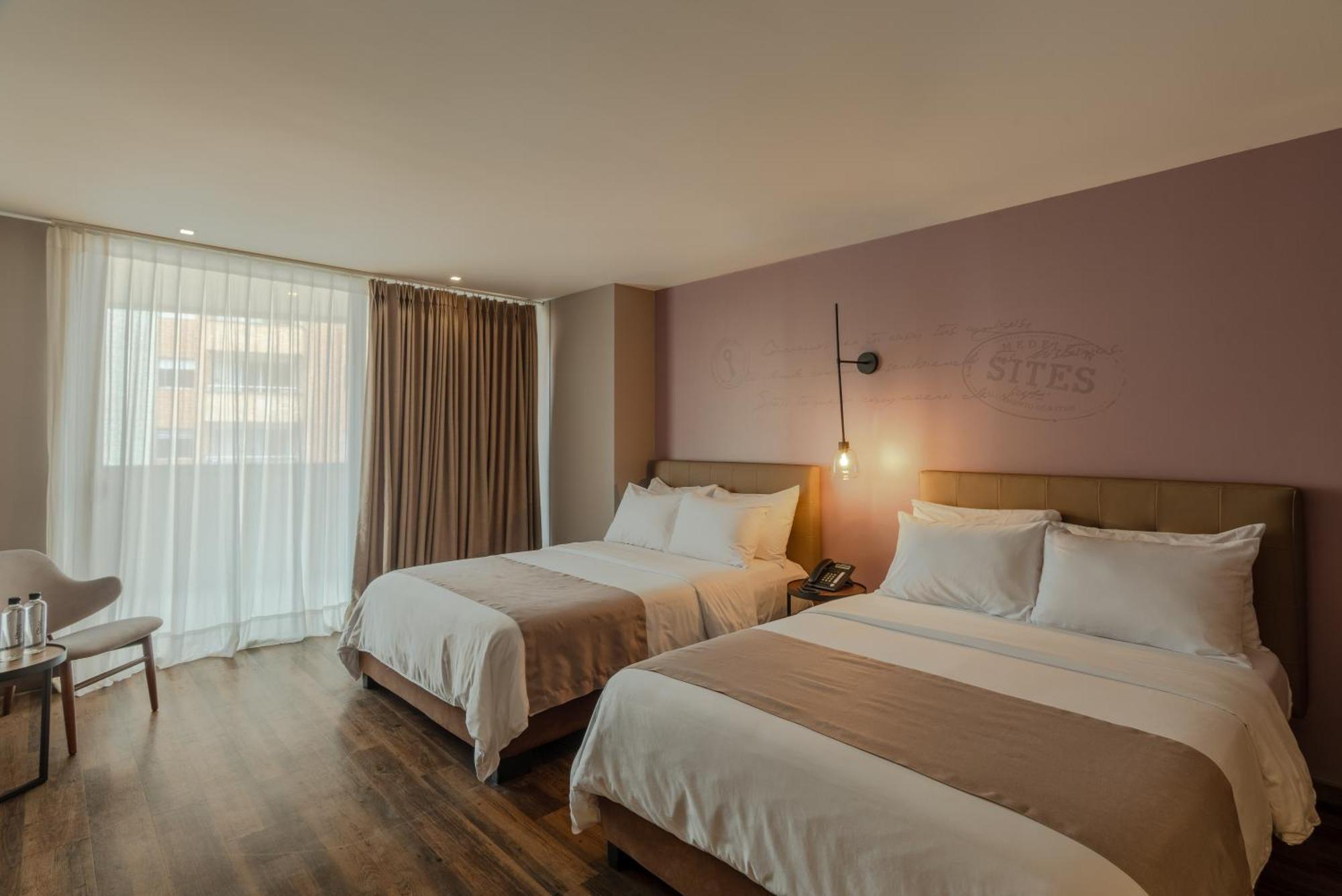 Sites Hotel Medellin Exterior photo A room at the hotel