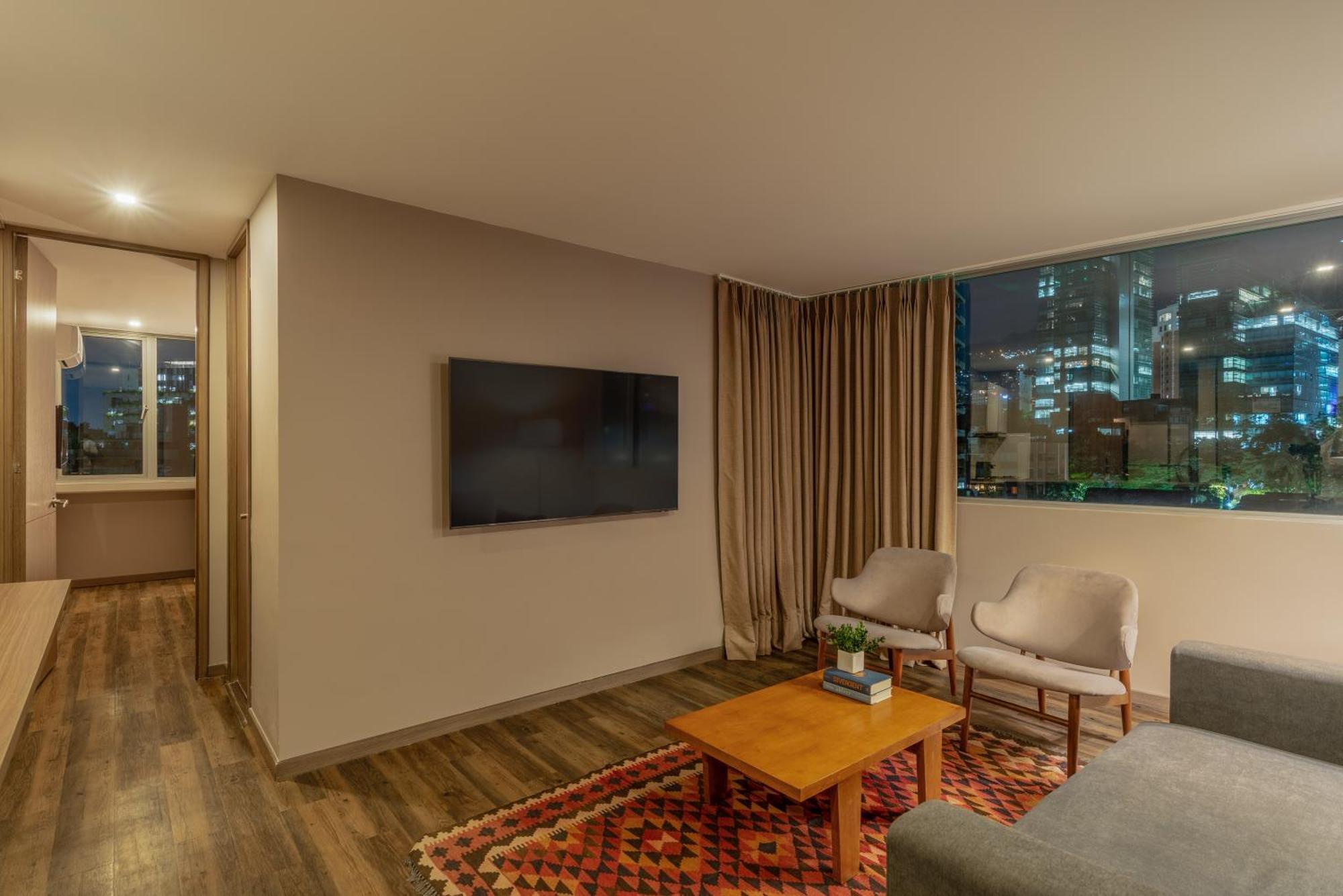 Sites Hotel Medellin Exterior photo A living room in a modern apartment
