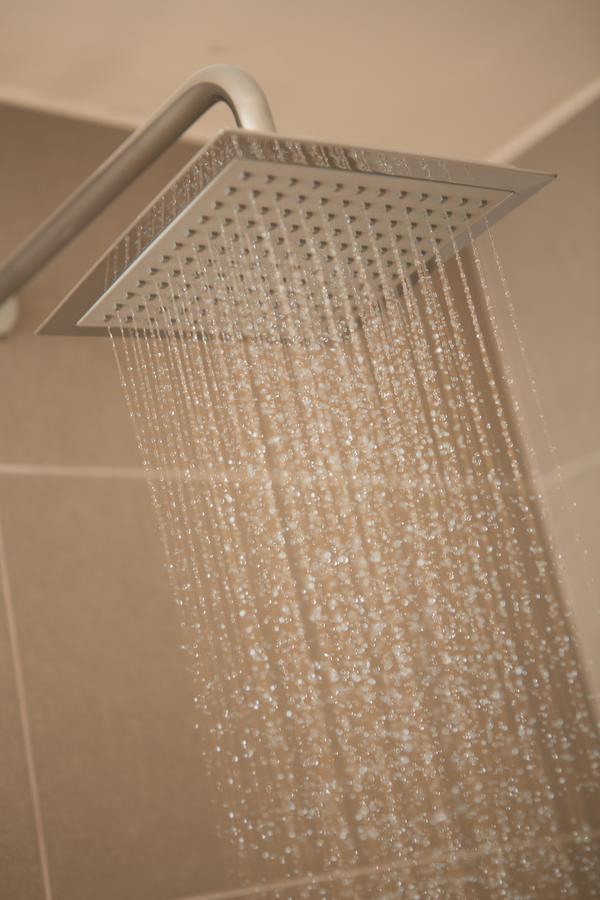 Sites Hotel Medellin Exterior photo A shower in operation