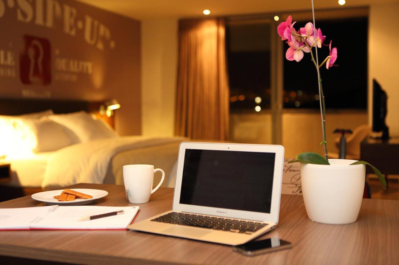 Sites Hotel Medellin Exterior photo A laptop computer